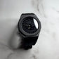 CASIOAK BLACK BEZEL ALL BLACK FACE AND BLACK RUBBER STRAP - GA 2100